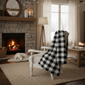 Farmhouse buffalo check plaid throw blanket on armchair by fireplace